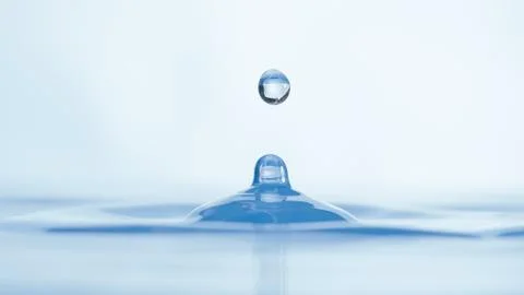 Drops of water on a blue background. Stock Photos