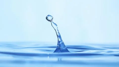 Drops of water on a blue background. Stock Photos