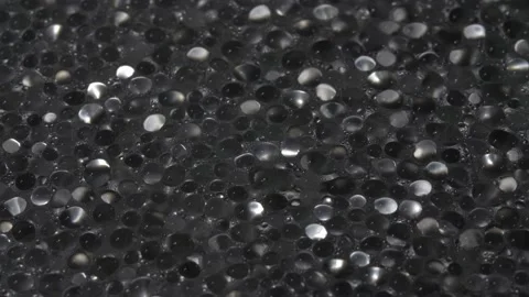 Drops of water close-up. Abstract background. Black base. Stockbeeldmateriaal 141548057