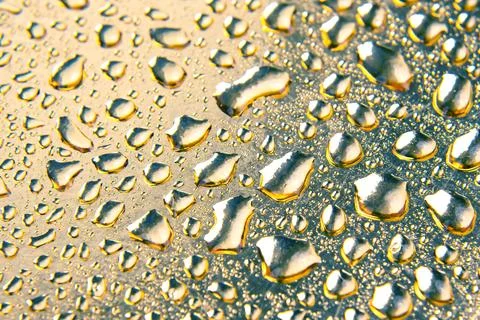 Drops of water on a colored background. Abstract texture Stock Photos