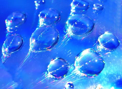 Drops of water on the compact disk Stock Photos