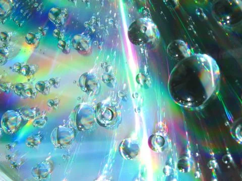 Drops of water on the compact disk Stock Photos