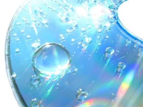 Drops of water on the compact disk Stock Photos