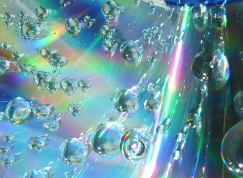 Drops of water on the compact disk Stock Photos