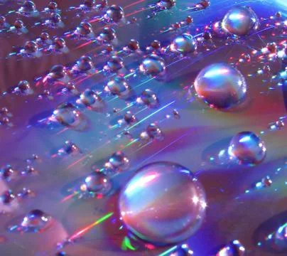 Drops of water on the compact disk Stock Photos