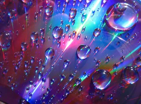 Drops of water on the compact disk Stock Photos