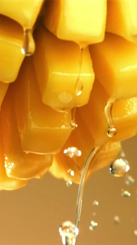 Drops of water drip from fresh mango. Filmed on a high-speed camera at 1000 fps Stock Footage 335310002