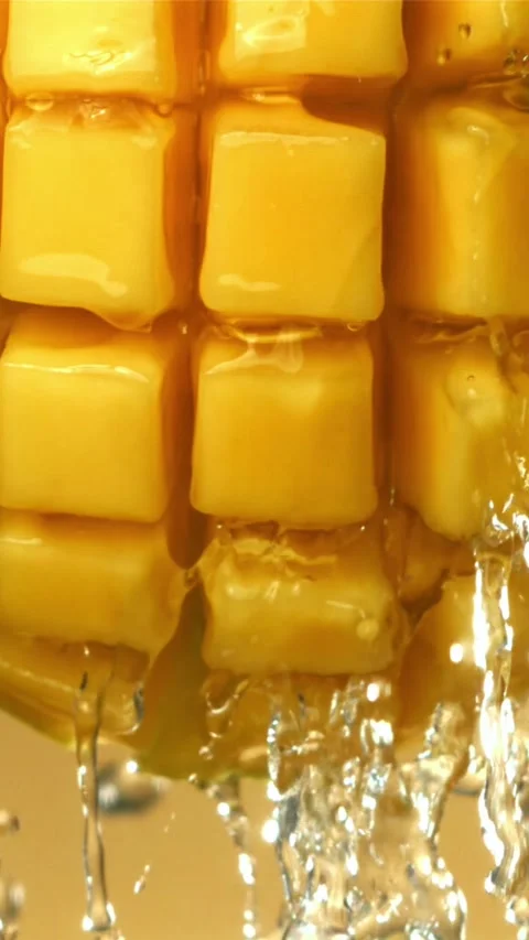 Drops of water drip from fresh mango. Filmed on a high-speed camera at 1000 fps Stock Footage 335321942