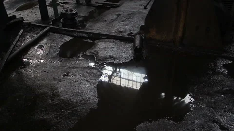 Drops of water dripping into a puddle Stock Footage 57278205