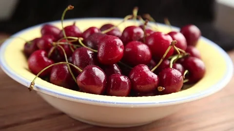 Drops of water fall on cherries Stock Footage 157477665