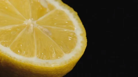 Drops of water fall on the cut lime on a black background. Stock Footage 113204636