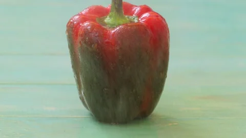 Drops of water fall on top of a red bell pepper Stock Footage 236542261
