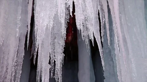 Drops of water falling from ice formation Stock Footage 331358322
