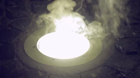 Drops of water falling over a fixed reflector in street pavement Stock Footage 59841308