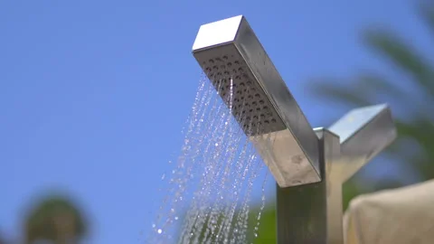 Drops of water falling from rain shower in slow motion 180fps Stock Footage 122275800