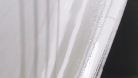 Drops of water flow down the body of the car. Drying the car after washing Stock Footage 94252168