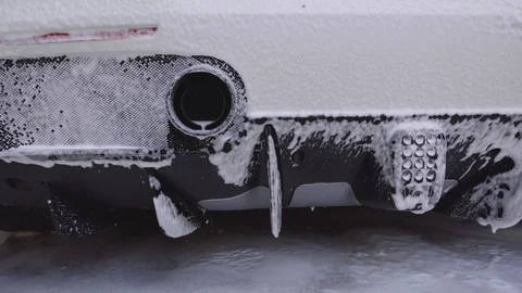 Drops of water flow down the body of the car. Drying the car after washing Stock Footage 94252739