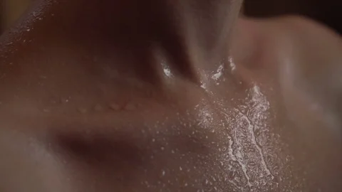 Drops of water flow down the skin. Beautiful young female body. close-up Stock Footage 74357359