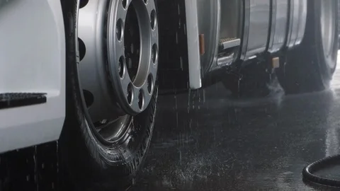 Drops of water flow down from a truck. Washing truck in slowmotion. Stock Footage 126096085
