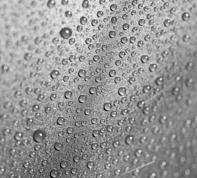 Drops of water on a gray background Stock Photos