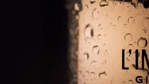 Drops of water on a perfume bottle, macro shooting of a drop of water Stock Footage 262154123
