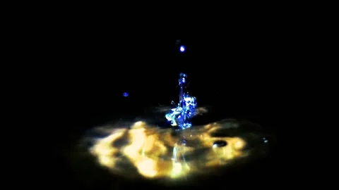 Drops of water quickly drip into the beam of the lantern. Stock Footage 97572535