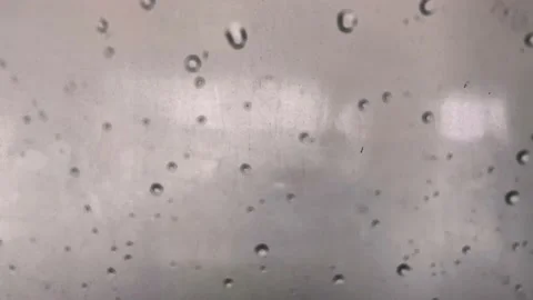 Drops of water rolling down the window Stock Footage 202558925