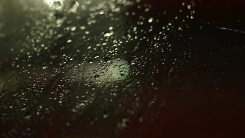 Drops of water run down the glass. Cold winter night. Light is on back side Stock Footage 165988598