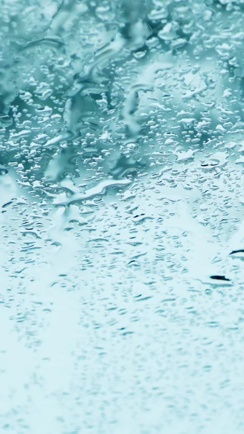 Drops of water run down the glass. Vertical video, shorts. Video stock 293138138