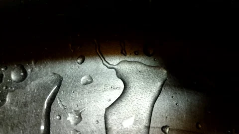 Drops of water on silver metal. Stock Footage 204936778