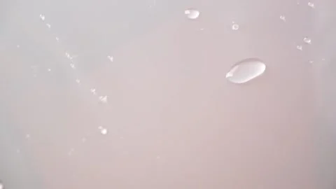 Drops water slide on the surface. Raindrops move on the glass. Drip condensate Stock Footage 229928123