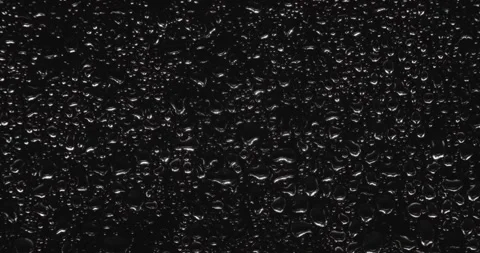 Drops of water sliding down Stock Footage 324877367