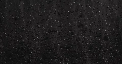 Drops of water sliding down Stock Footage 324877375