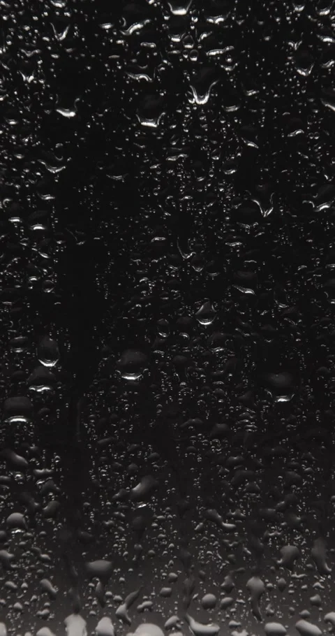 Drops of water sliding down Stock Footage 324877387