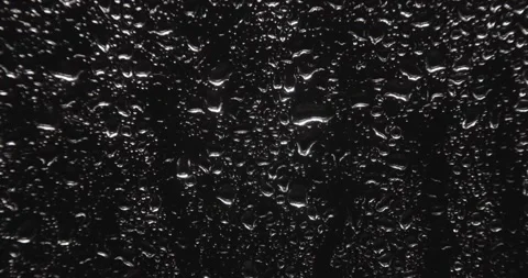 Drops of water sliding down Stock Footage 324877388