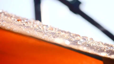 Drops of water in slow motion fall on the roof of the tent Stock Footage 197860403