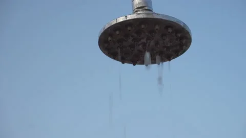 Drops of water slowly flow down on the city's beach background to clear skies Stock Footage 139463964