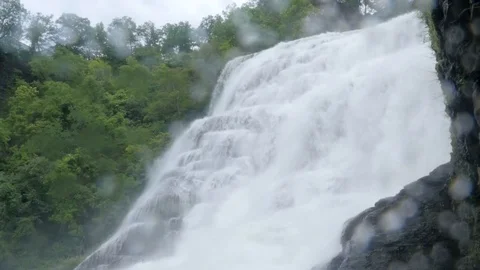 Drops of Water Splash from a Large Waterfall Stock Footage 81765914