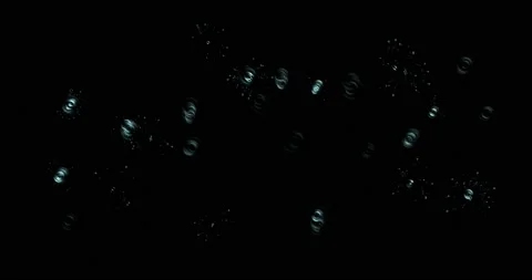 Drops of water splashes fly and fall, motion graphics of rain bubbles on a black Stock Footage 201442108