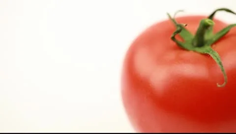 Drops of water on tomato Video stock 10600163