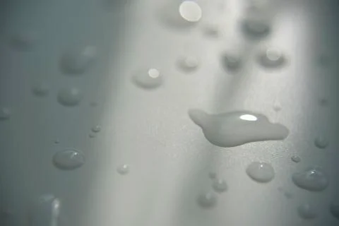 Drops of water on white surface with shadow Stock Photos