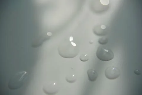 Drops of water on white surface with shadow Stock Photos