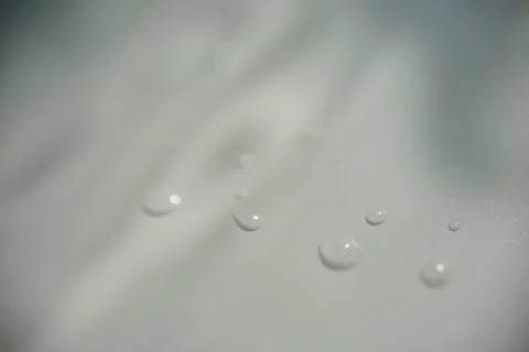 Drops of water on white surface with shadow Stock Photos