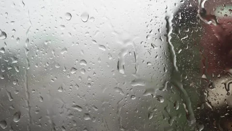 Drops of water on the window glass during heavy rain. Video stock 247407219