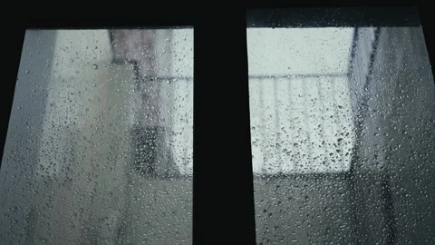 Drops of water on the windows after rain, rain running down the roof. Stock Footage 324105054