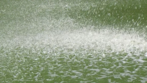 Drops of a waterfall with strong pressure fly to the surface of the water. Video stock 249955851