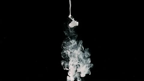 Drops of white ink in water. Slow motion of liquid white ink Video stock 160671969