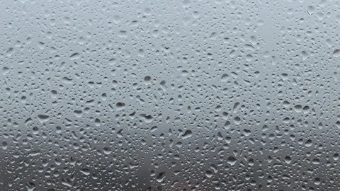 Drops on the window in motion Stock Footage 124886455