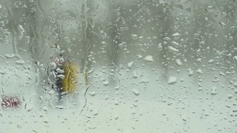 Drops on the window. Snowfall in the city Stock Footage 71421411