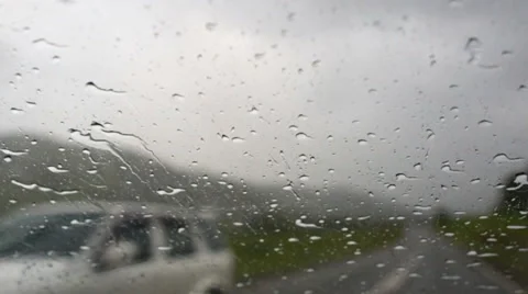 Drops on the windshield of the car. The car rides in the mountains. Stock Footage 66619685
